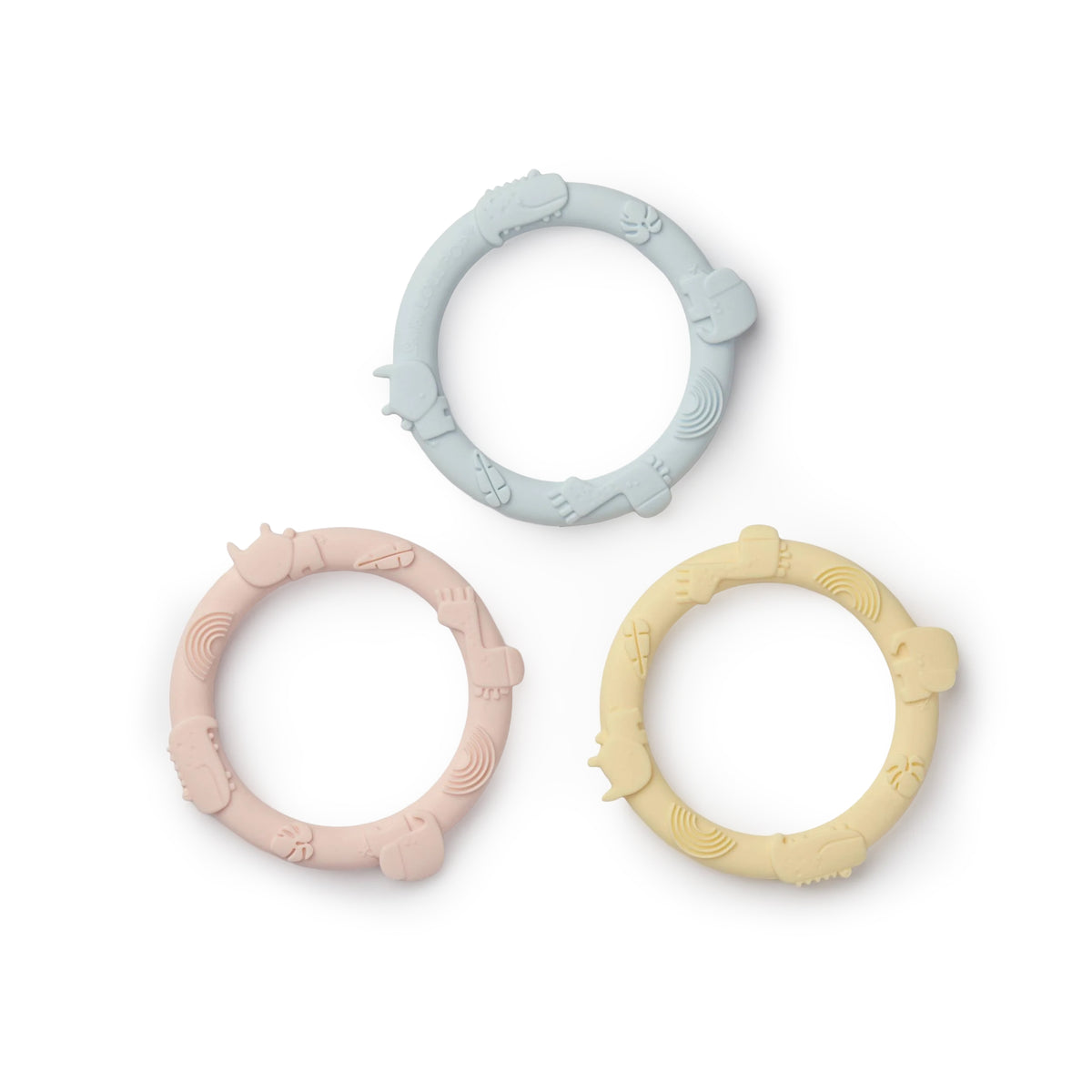 Three silicone teething rings in pastel colors on a white background